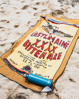 Castlemaine XXXX ECO beach towel at the beach