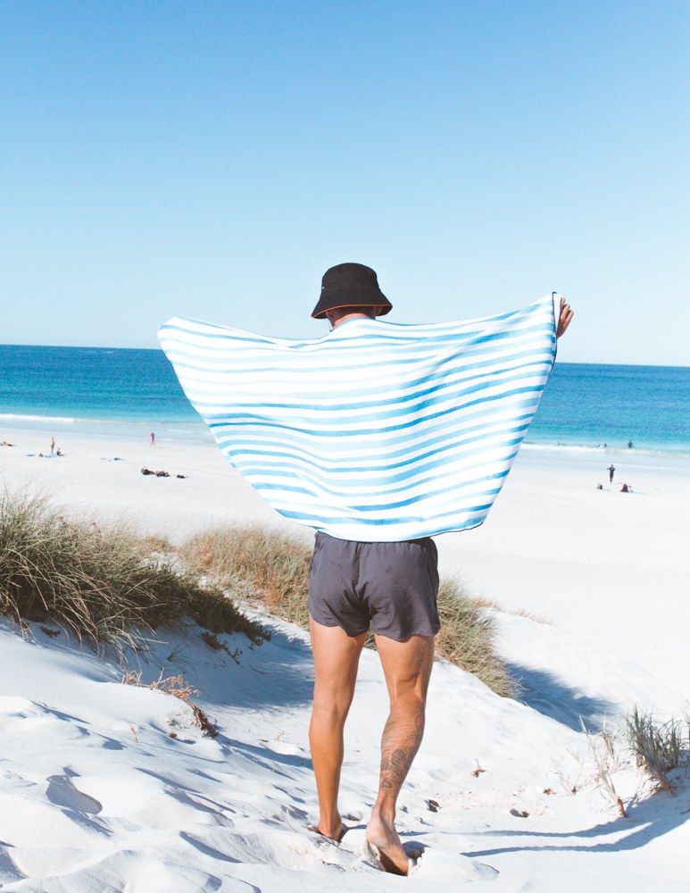 Main Beach ECO beach towel at the beach