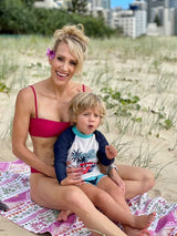 Tribal Pink ECO beach towel at the beach